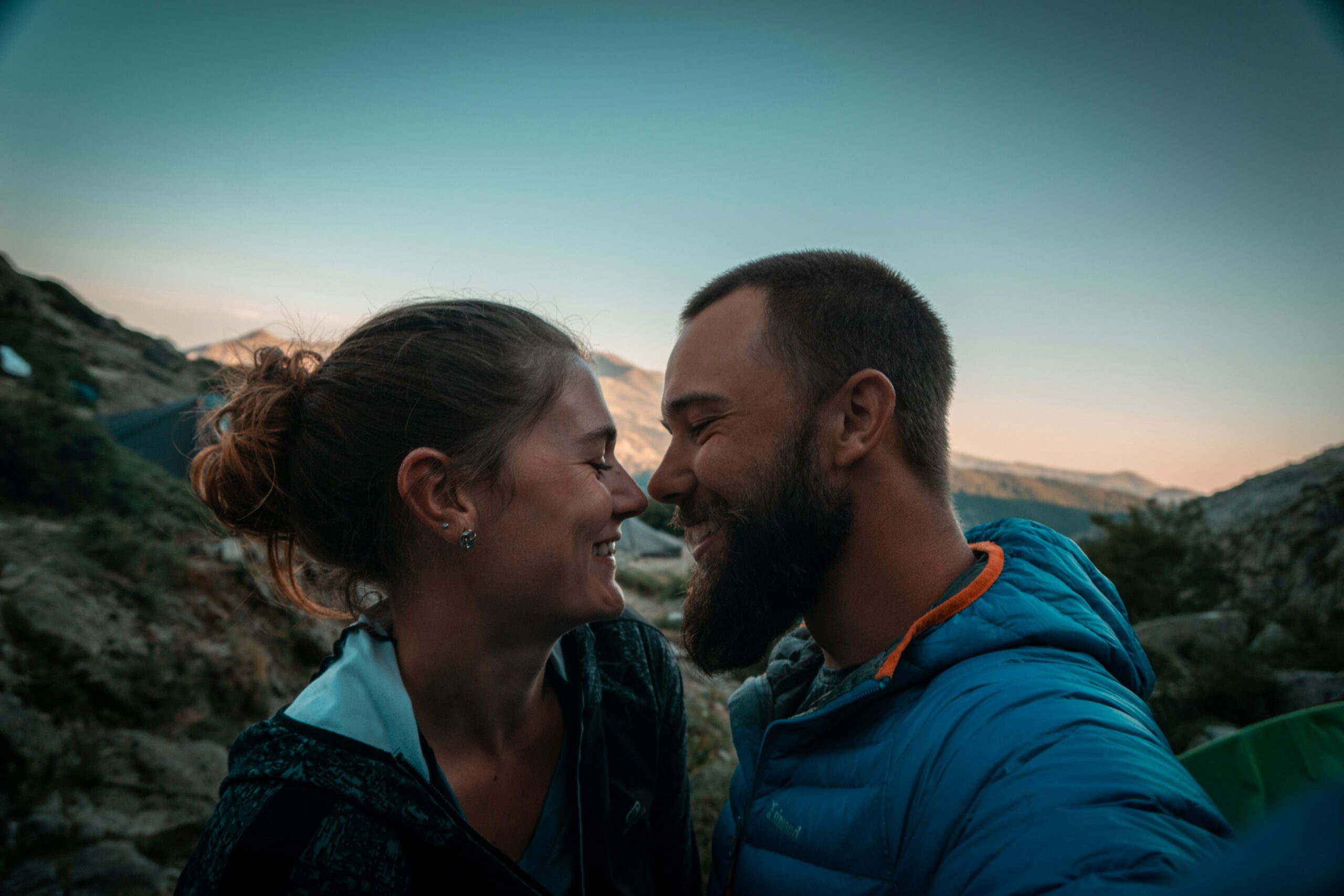 Couple about to kiss in mountains